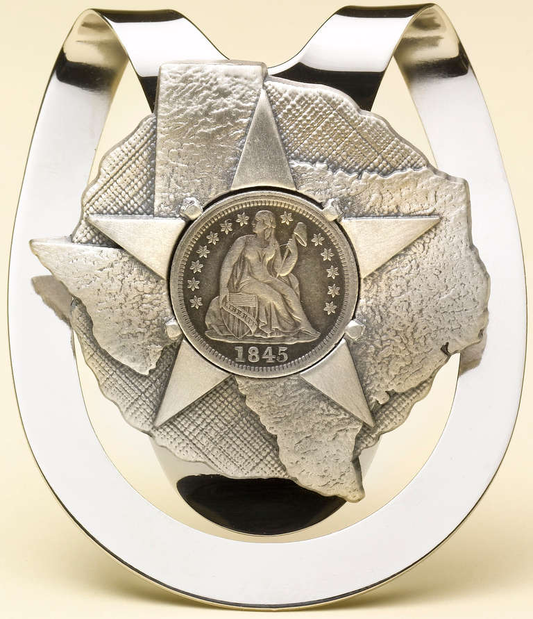 This authentic 1845 seated liberty half-dime has been mounted by a master silversmith to create a beautiful commemorative Texas statehood silver money clip. Custom designed by The Great Republic, each piece is hand numbered in an edition of 100