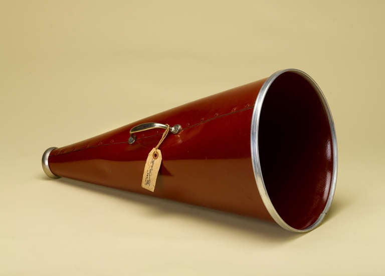 This is a vintage bright red megaphone in very good to excellent condition.