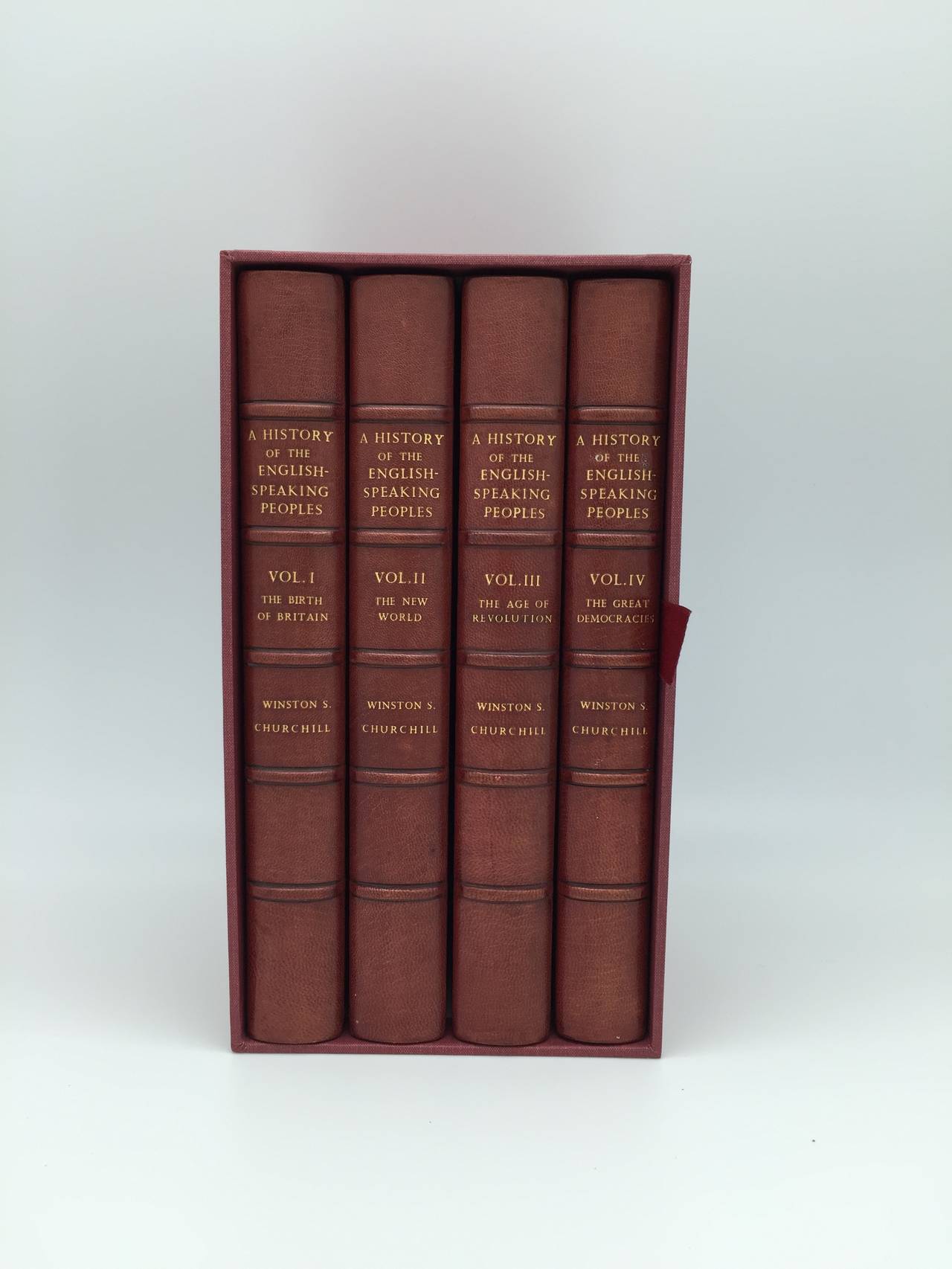 “CHURCHILL’S LAST GREAT WORK”: HISTORY OF THE ENGLISH-SPEAKING PEOPLES - Signed First Edition Set 

Four volumes - volume three signed by Winston Churchill. Octavo, period full red morocco bindings with gilt raised bands, gilt decorated spines and