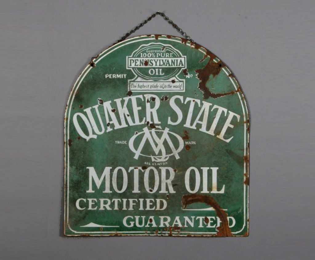 This is an original double-sided, arched top, Quaker State Motor Oil porcelain advertising sign with original hanging chain.