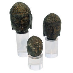 Set of Three Granite Buddha Heads on Lucite Stands
