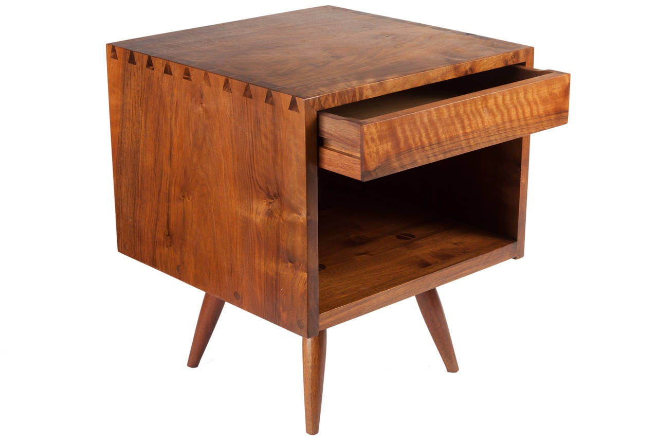 Single George Nakashima nightstand or end table in American black walnut. Dovetail joinery and a single drawer. Provenance included.