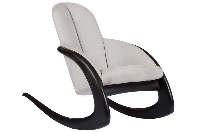 Iconic Crescent Rocker by master American craftsman Wendell Castle. Upholstered in light gray ultra suede with black stained wooden frame. Signed 