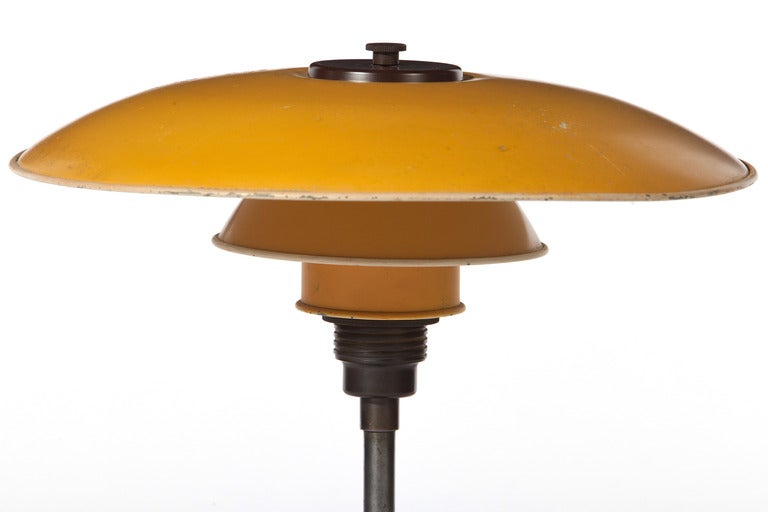 Early 1930's  Poul Henningsen  3.6/2.5 desk lamp in brown brass and bakelite marked PATENTED with yellow zinc metal shades in very good original condition.