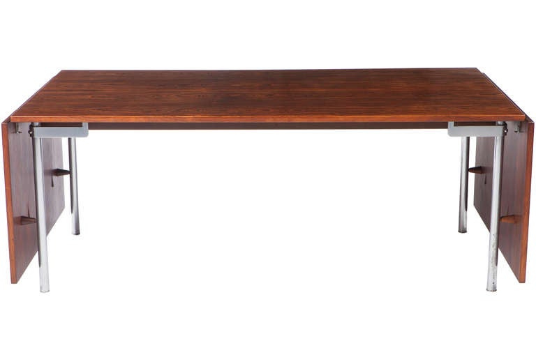 Large and rare Hans Wegner rosewood and steel legged drop-leaf dining table. Leaves can be also be removed. Manufactured by Cabinetmaker Andreas Tuck. Table measures 28