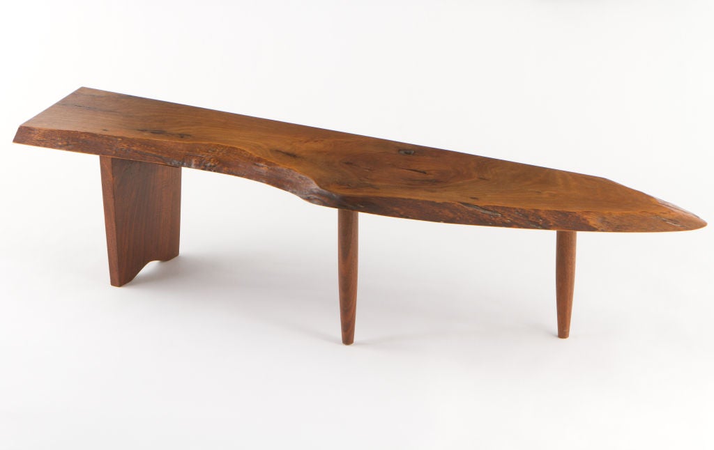 George Nakashima R bench. An expressive, single slab top with free-edges, fissures and knot details. Sold with a copy of original drawing by the artist. Signed with client name to underside: [Cook].