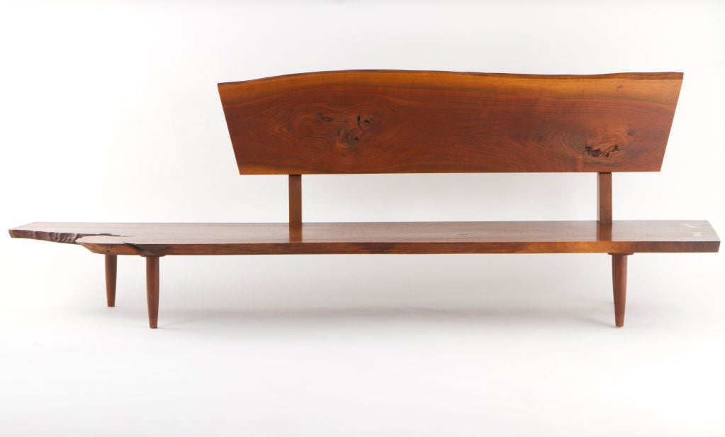 Fantastic Nakashima bench with backrest.Seat with expressive free-edge, fissures and two butterflies. Functional form with great scale.Bench comes with provenance.