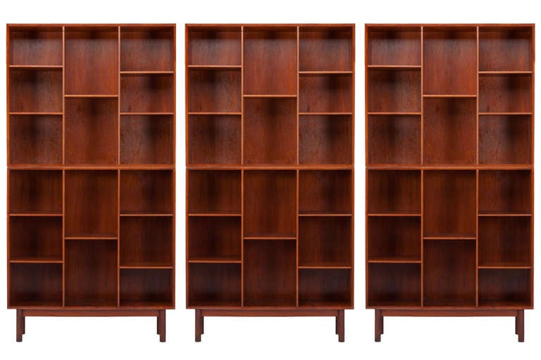 Impressive set of six teak bookcases designed by Peter Hvidt. Each with exposed finger joints and adjustable shelves. Manufactured by and signed 