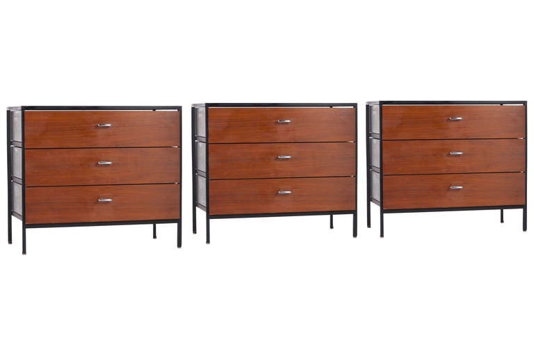 Set of 3 of Steel Frame dressers designed by George Nelson for Herman Miller circa 1950's. Walnut fronts,green painted sides and black tops signed with foil labels.