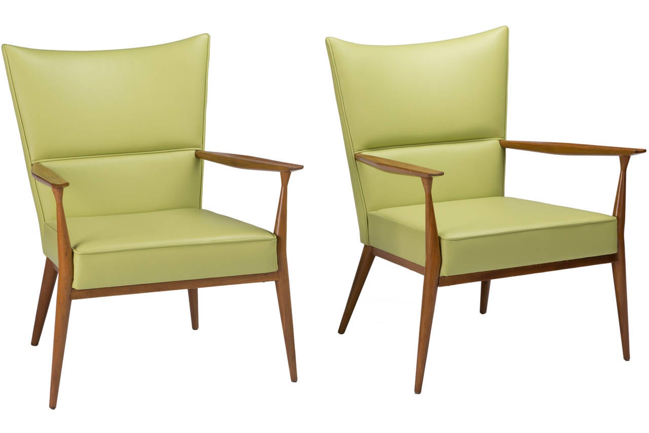 Pair of mahogany Paul McCobb lounge chairs manufactured Calvin and have been perfectly reupholstered in chartreuse leather.