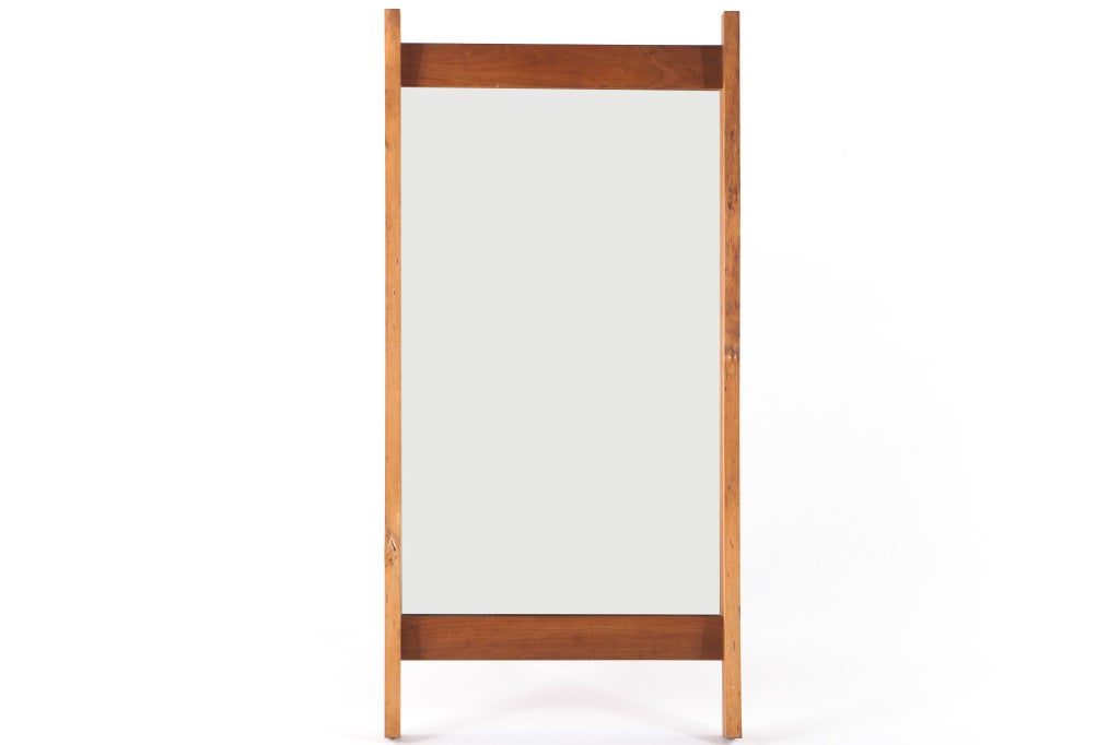 Large Nakashima wall mirror with free edges,knots,and mortise and tenon details.Mirror comes with complete provenance.
