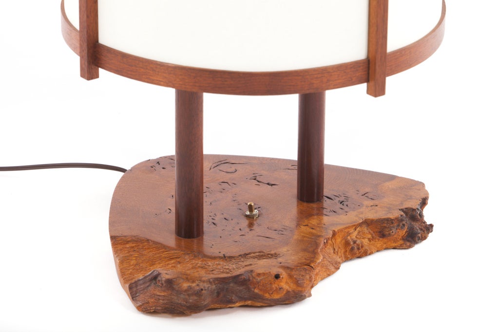 Extremely large and rare formed lamp designed by George Nakashima executed in 1962. With an English burl base with free-edges ,walnut standards and parchment shade.This form rarely comes to market. Signed to bottom with clients name. Provenance