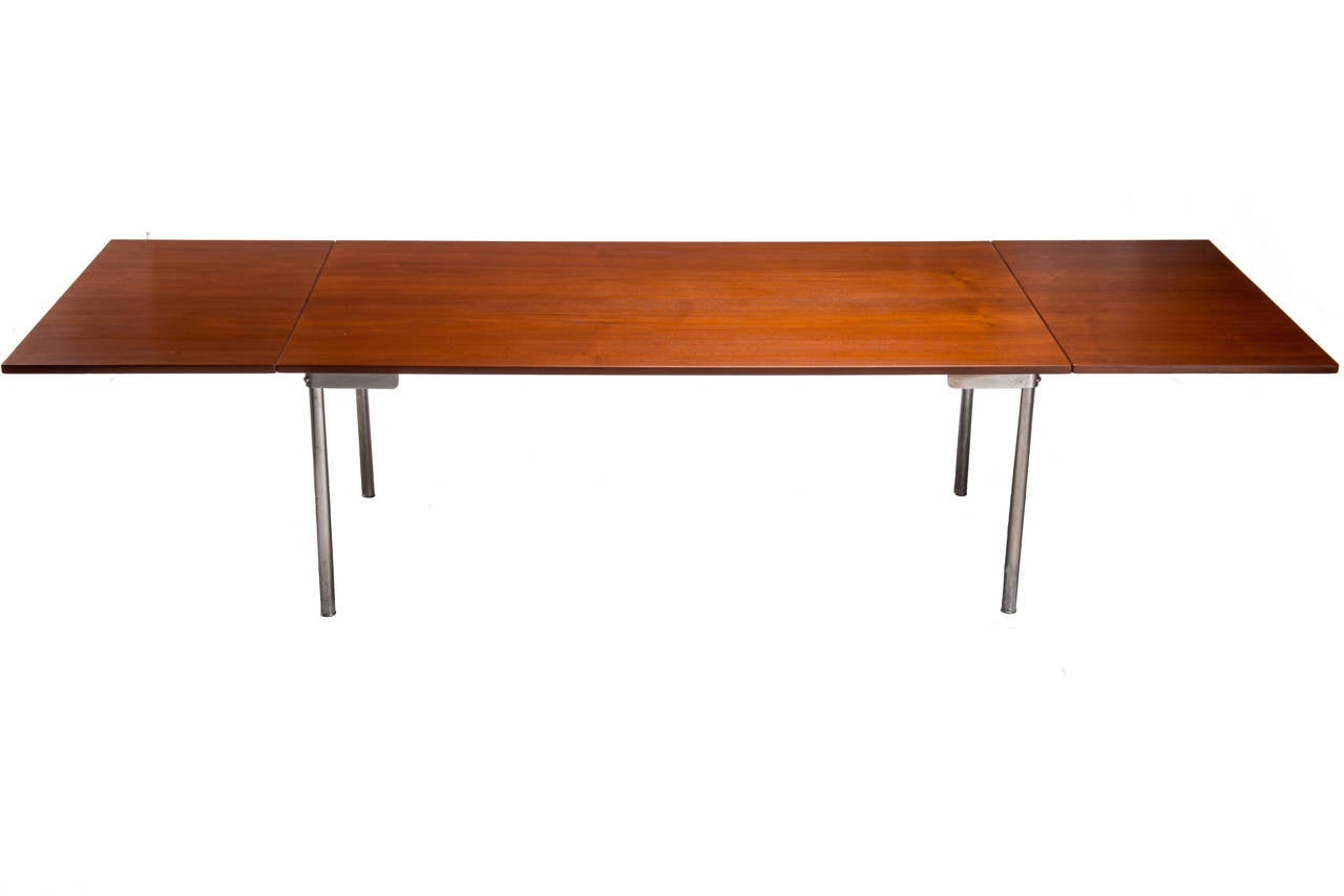 Large and rare Hans Wegner teak and steel legged drop-leaf dining table. Leaves can be also be removed. Manufactured by Cabinetmaker Andreas Tuck. Table measures 28