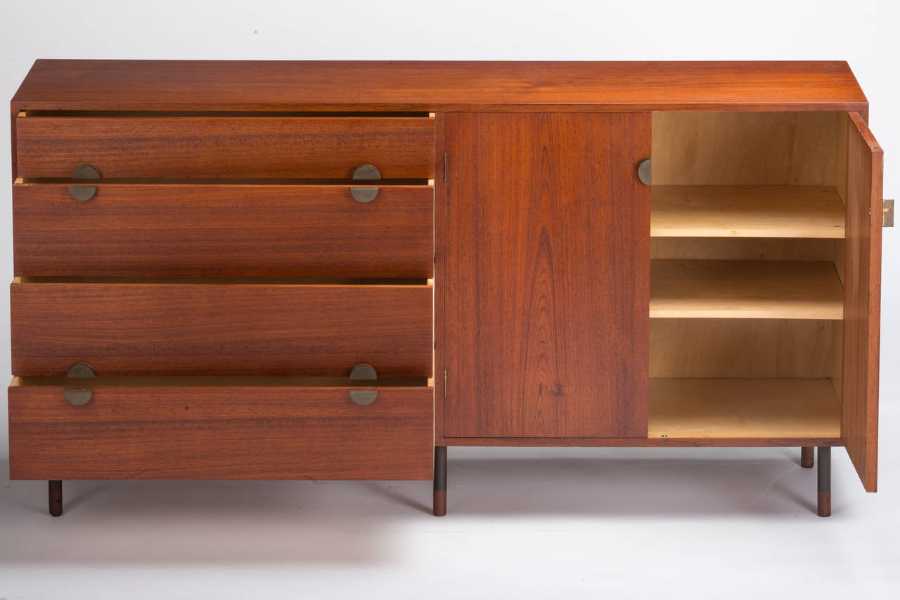 Nice teak Juhl cabinet manufactured by Bovirke with brass pulls on blackened steel legs with teak tips. Stamped 