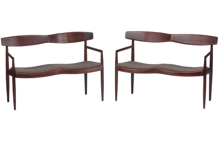 Rare and early PAIR of walnut settees or benches by Sam Maloof. Simple but elegant design from California's preeminent woodworker. Branded to bottom  