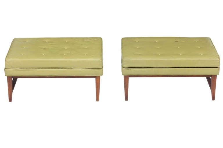 Rare pair of Dunbar ottomans from the Janus line in original chartreuse leather designed by Edward Wormley. Signed
