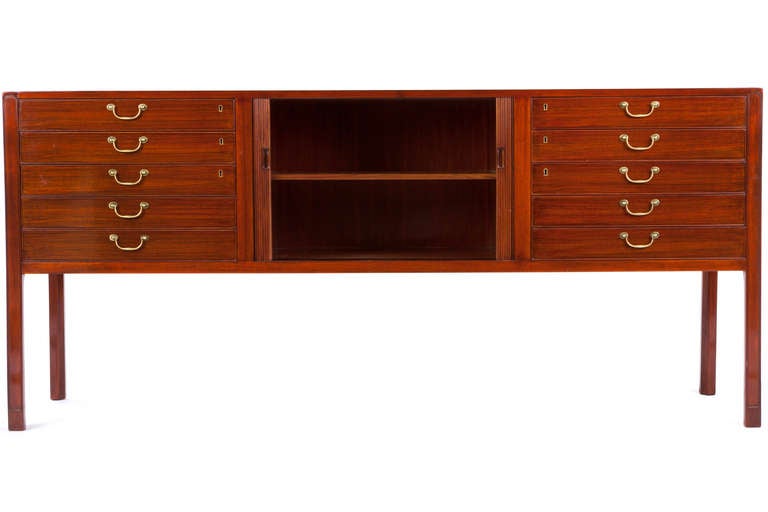 Elegant rosewood sideboard designed by Ole Wanscher and manufactured by A.J. Iversen. Beautifully detailed with tamboured doors and ten drawers and one shelf. Labeled.