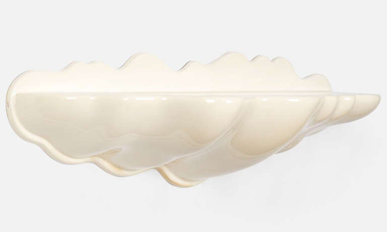 Extremely rare Wendell Castle wall mounted shelf. Approximately thirty or forty examples of the Cloud shelf were produced in 1969. This work has been authenticated by Wendell Castle. Iconic and scarcely seen design from Castle.