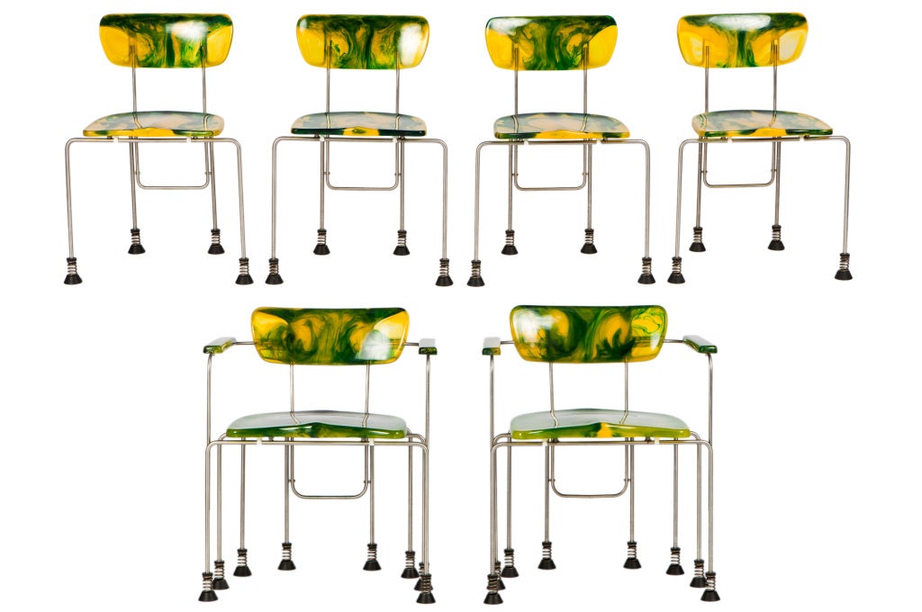 Broadway cast resin dining set designed by idiosyncratic Italian designer Gaetano Pesce.Set includes one table, two armchairs and four side chairs; armchairs measure: 25 w x 21.5 d x 30 h inches and chairs measure: 21.5 w x 17 d x 29 h inches.
