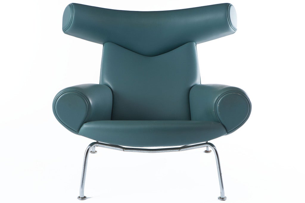 Hans Wegner Ox chair in rare blue leather. Designed in 1960, the Ox chair was originally produced by A.P. Stolen, but only until 1962 due to technical and market problems. It remained out of production until 1985, when it was re-issued by Jorgensen,