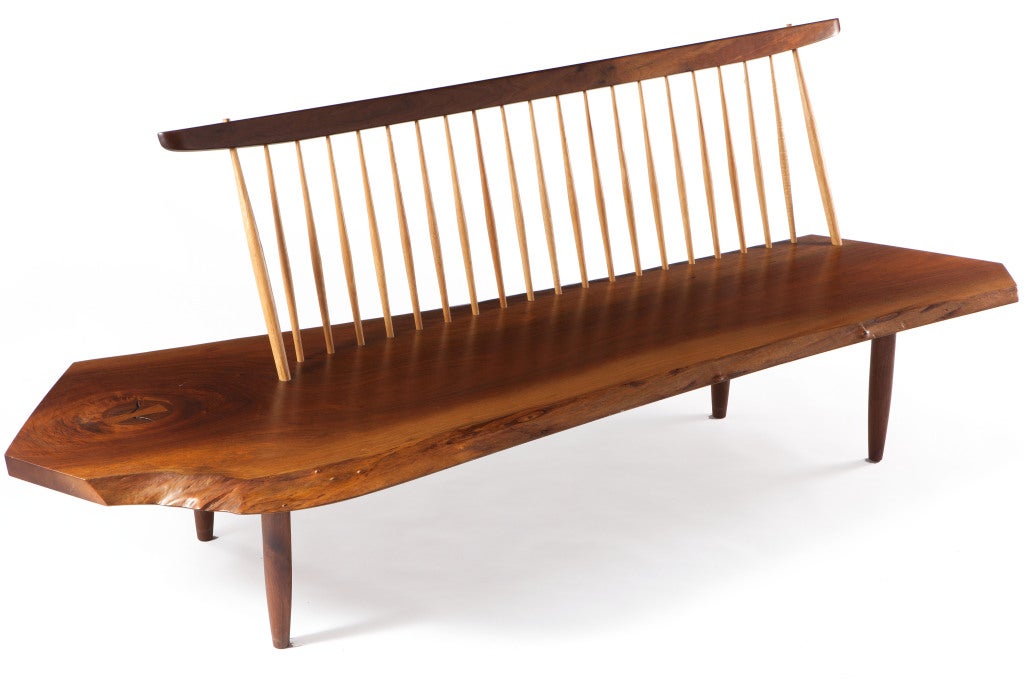 A very fine example of George Nakashima's iconic Conoid bench.Expressive single-slab top with one rosewood butterfly, knot details and two free edges. Signed and dated with client's name to underside: (George Nakashima April 15, 1987 Pirie)