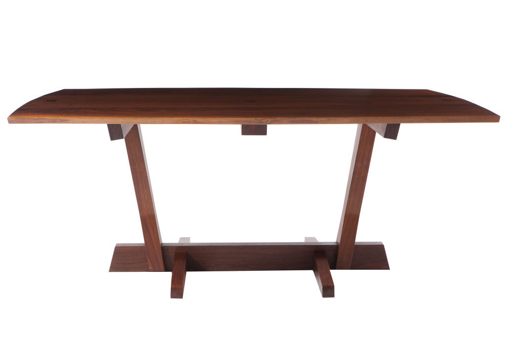  A fine George Nakashima Conoid dining with an exceptionally wide tabletop, two solid book-matched slabs with sap-grain detail and two free edges joined by three rosewood butterflies. Sold with copy of the original drawing and receipt.With full