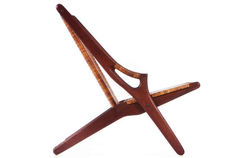 Rarely found solid teak frame with cane back and seat and cane wrapped arms. Made by A.R. Klingenberg and Son.