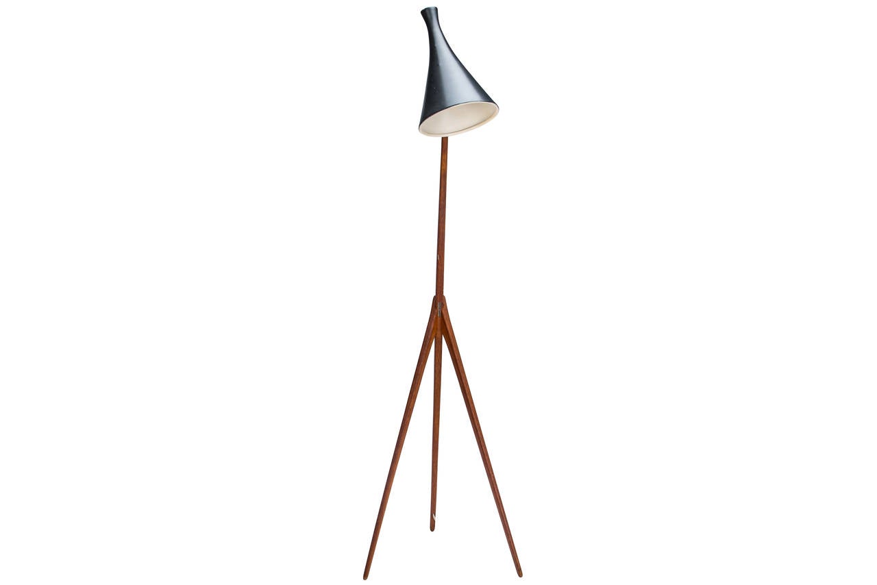 Adjustable floor lamp designed by Uno & Osten Kristiansson for Luxus Vittsjö of Sweden, circa 1958. Retains original Luxus Vittsjö label. Constructed of oak, aluminum and brass. Very good condition with some minor wear to shade commensurate with