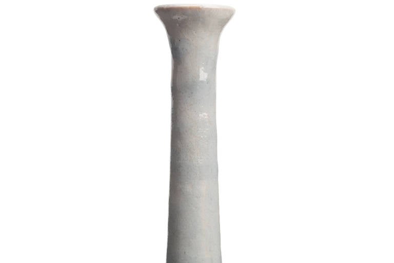 Elegant slender vase by Guido Gambone in a solid white glaze. Signed with donkey mark.