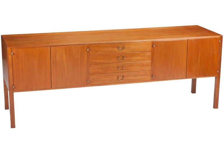 Beautiful, elegant and large sideboard designed by Josef Frank. Manufactured by Svenskt Tenn, circa 1940s. Cabinet features four doors concealing one adjustable shelf per compartment; four drawers, two of which are felt-lined. All doors and drawers