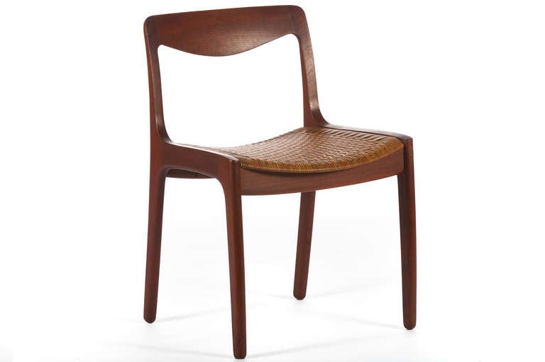 Beautiful set of 12 dining teak dining chairs designed by Vilhelm Wohlert and manufactured by P jeppesen of denmark and retailed by Illums Bolighus. Teak frames with perfectly patinated caned seats.