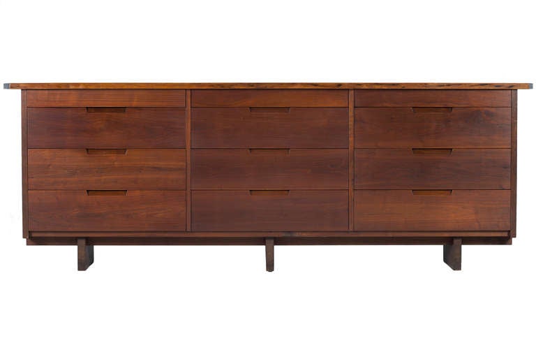 Rare and large and 8 ft. walnut 12 drawer George Nakashima chest with a free-edge and double overhanging top.Chest with graduating sized drawers,dividers and expressive walnut top. Comes with provenance and signed with clients name to back.