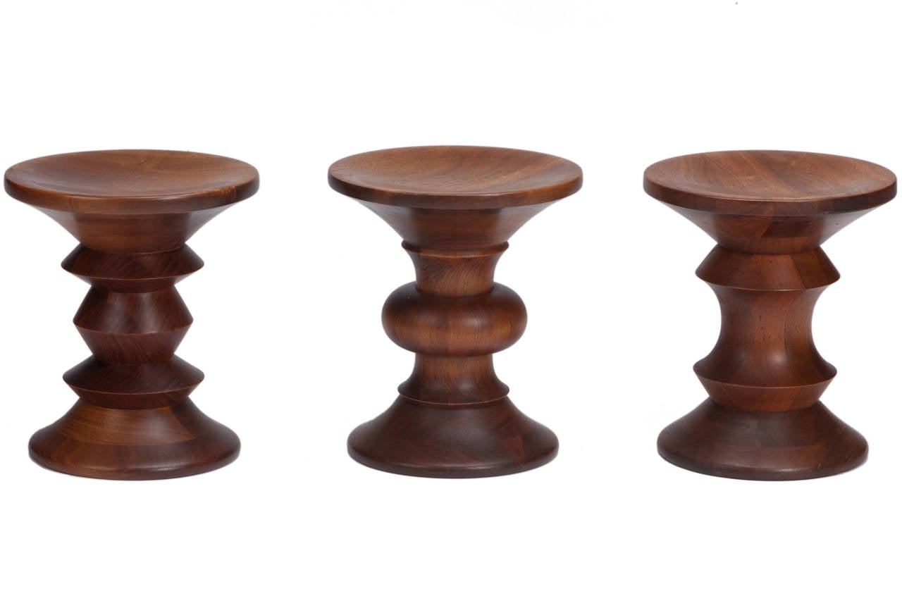 Set of three vintage oiled walnut Time-Life stools designed by the Charles and Ray Eames and manufactured by Herman Miller. Collection represents all three different stool designs created in 1961 for the lobby of the Time Life Building in New York