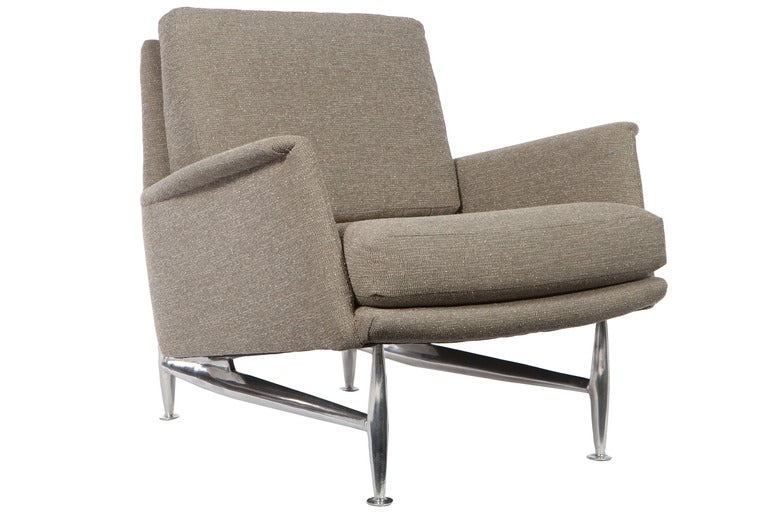 Great modernist armchairs by Donald Deskey for Charak Modern. High quality construction with solid polished aluminum legs. Nicely redone fabric. Interesting later design by one of America's most influential designers.