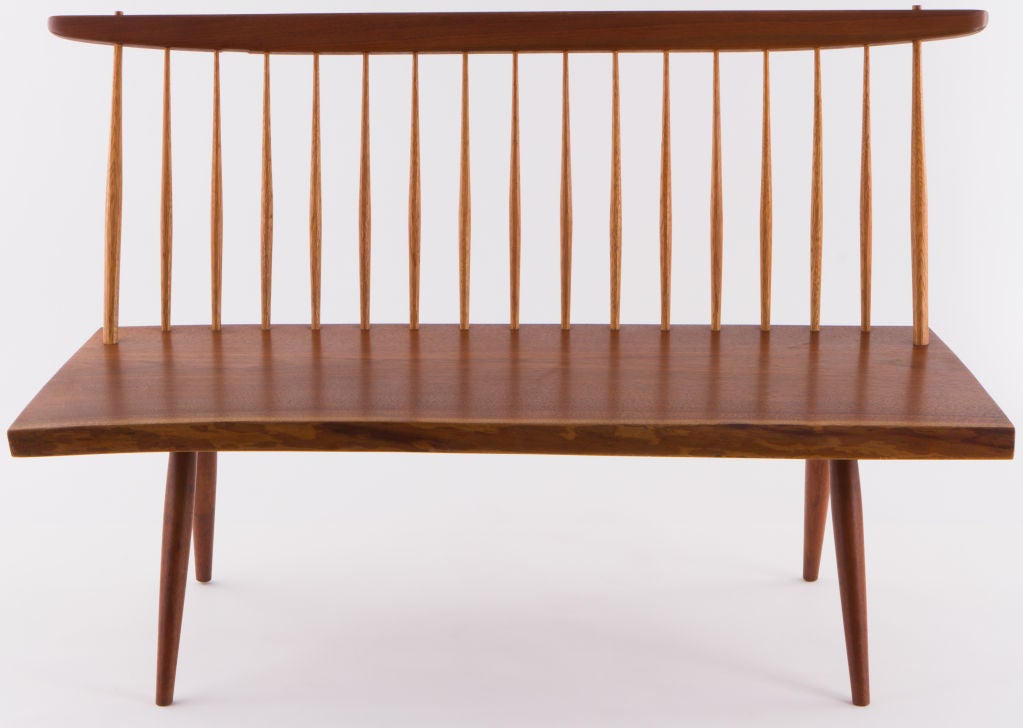 Elegant George Nakashima spindled back settee.With free edge plank seat.Signed with clients name to bottom. Provenance included.