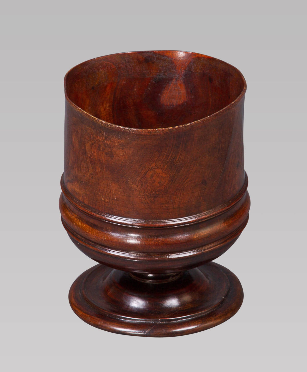 This large drinking cup was well turned with very thin & delicate sides and has subsequently developed a slighly oval shape that adds considerably to its charm and appeal. 

Wassail bowls were traditionally used throughout England as communal cups