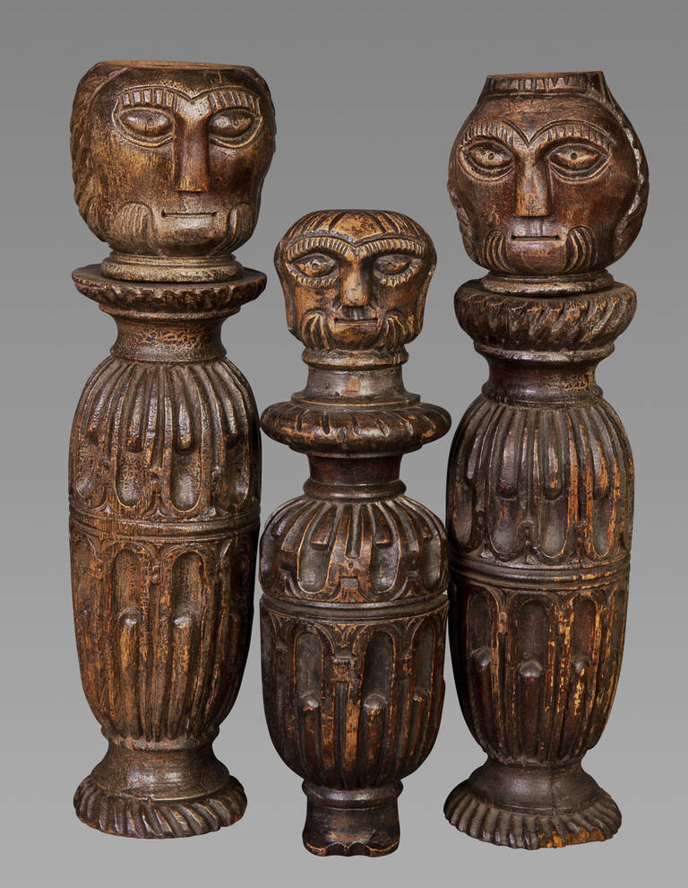 A delightful set of three figures, probably carved from either table legs or bed posts, and dating to circa 1620. These figures have been painted in the 17th century and display a naivité consistent with regional English carving. The oak used in