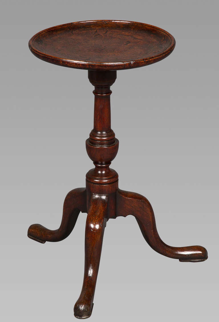 A beautiful table of diminuitive size, the top being only 11 inches in diameter and with an overall height of 19 inches. With a wonderful burr-oak figuring and patina, the underside of the top retains its original dry coloring.