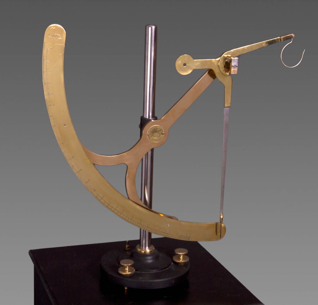 A beautifully designed and stylish set of French brass and ebonized fabric scales. These would have been used by a fabric manufacturer or retailer to calculate the quantity of cotton required to produce a certain length of cloth. By hanging one