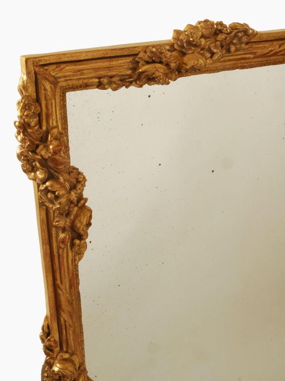 French Louis XVI Carved Giltwood Mirror.