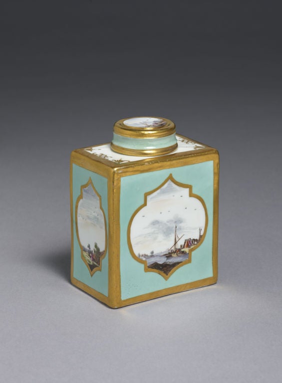 Meissen Robin's egg blue-ground rectangular Tea Caddy and Cover. One wide and one narrow side painted with harbour scenes beneath an expansive sky, the other two panels with gallants and companions in park settings, each reserved within original