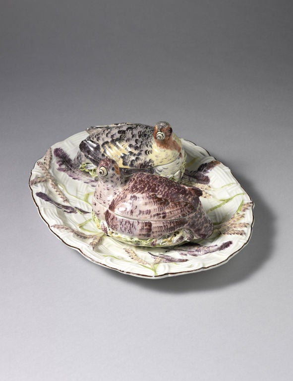 An Important Pair of Chelsea Partridge Tureens and Covers together with their Stand, each partridge modelled seated on a nest, the lower part of the tureen moulded in crisp low relief, with basket weave beneath applied sieved clay decoration and