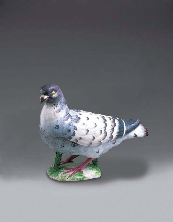 A Strasbourg rare Pigeon Tureen and Cover naturally modelled and painted in “petit feu” colours with brown beak and yellow eyes, its dark-grey and purple head with dark-grey markings, its grey chest with a white patch, the white plumage of its