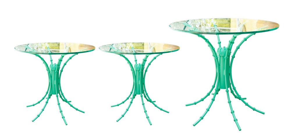 Three (3) iron tables with turquoise hi-gloss finish and glass top. 1 large table and 2 side tables sold separately or together. Large table measures 29h x 36 diameter and two side tables measure 20.5h x 24 diameter. Price for large table, $540.