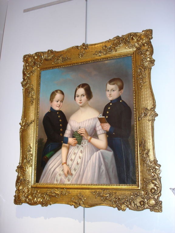 A 19th century Austrian oil on canvas portrait of three children in original gilt frame. Signed on the back 
