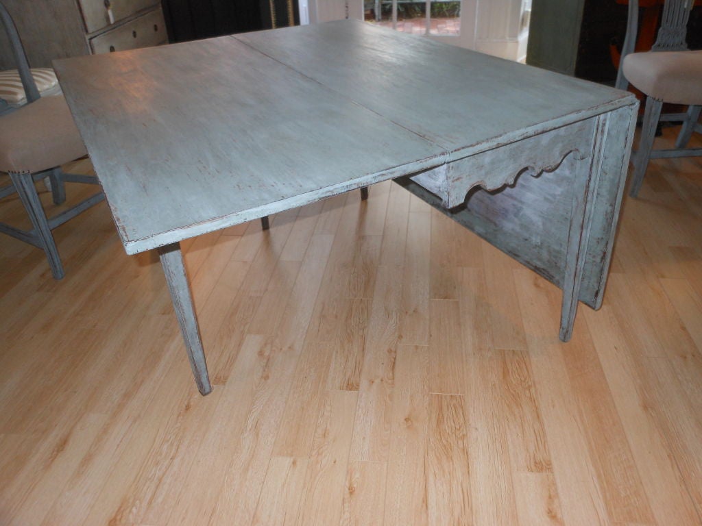 Lovely antique Swedish drop-leaf dining room table, later hand painted in bluish grey