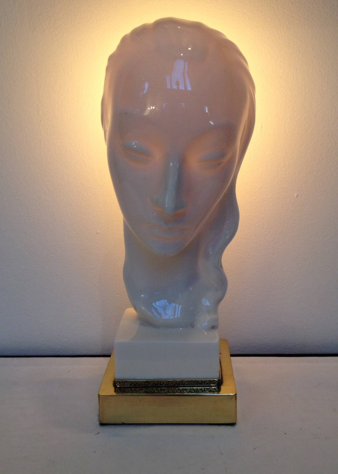 Art Deco white porcelain female face lamp with brass base, new wiring but all original back fixture.