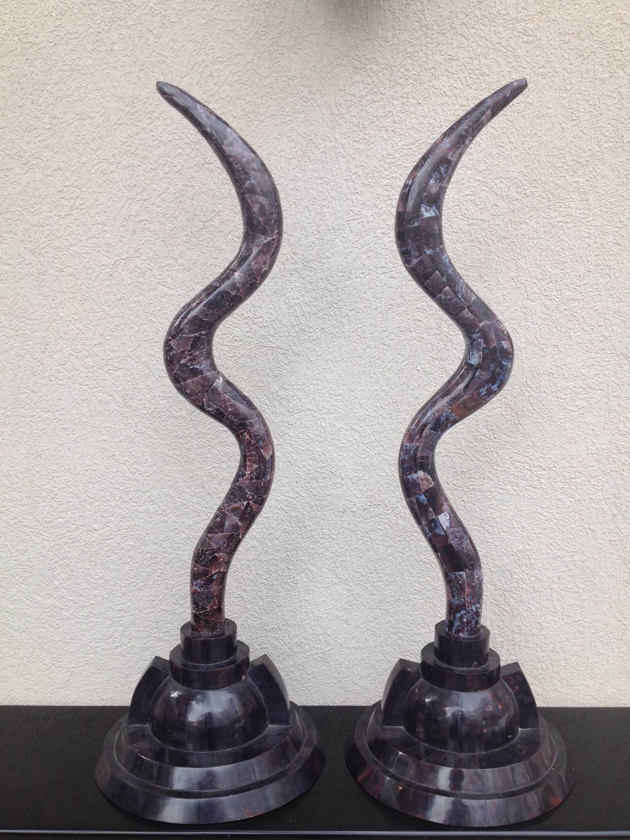 Pair of Marcius for Casa Bique Fossil stone antler shaped sculpture, bases in a tortoise colored deco design step base. And the stone work on tops is mixture dark brown purple and creme vein.
