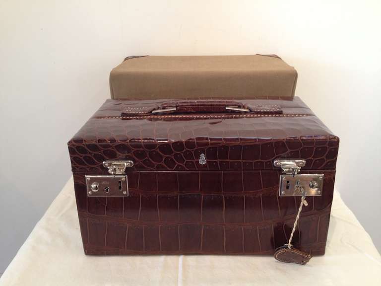 Rare and exceptional mark cross embossed signed toiletry/travel case, with original canvas leather trim cover, interior outfitted and plastic lined, with travel mirror with back to stand,with lock and key.  All original