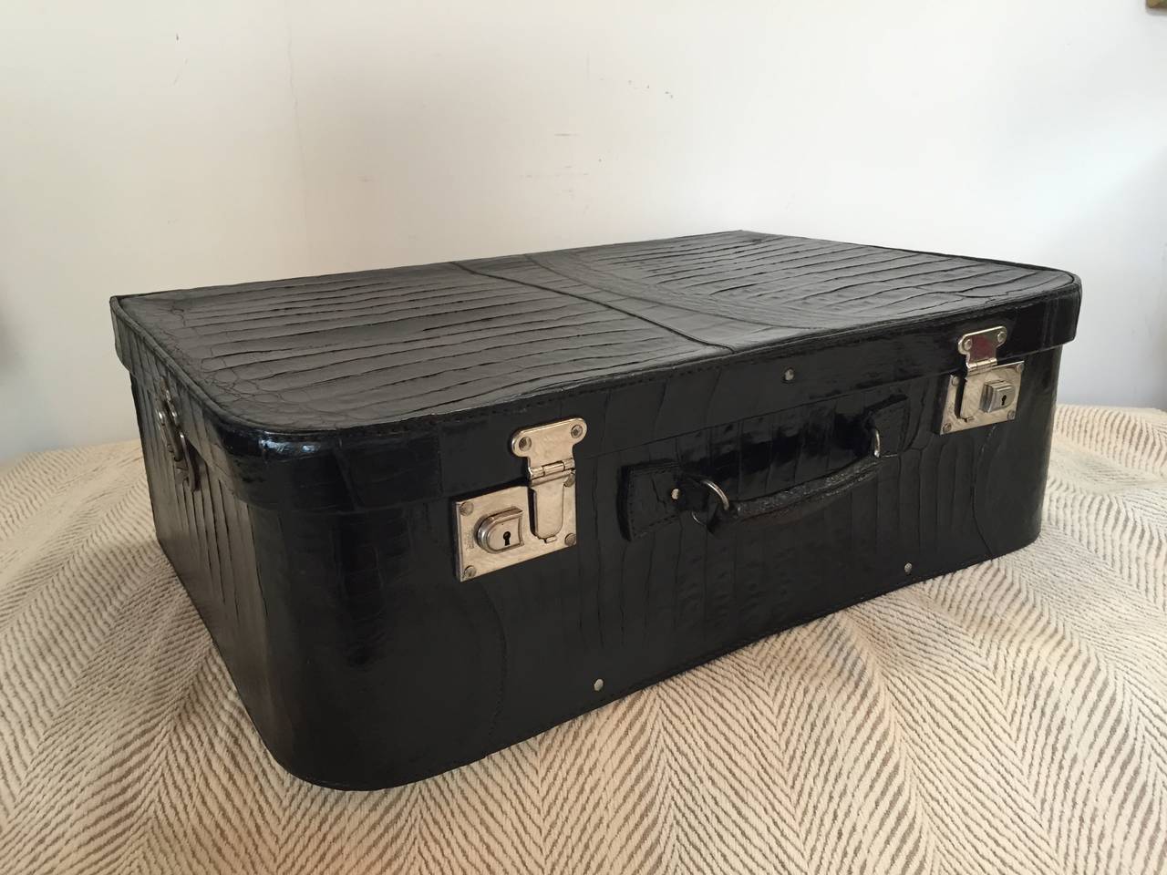 Art Deco black alligator suitcase with original satin lining and straps. Chrome hardware and original label. America Pedro P Diaz Arequipa De Peru.